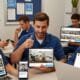 Home service professionals viewing social content on multiple devices, showing the draw of viral marketing