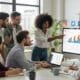 Diverse professionals collaborating on social media strategies in a modern workspace