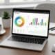 Workspace with a laptop displaying SEO analytics and colorful charts