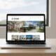 Laptop displaying a contractor website in a clean, modern workspace — a symbol of business growth