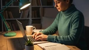 Person writing SEO content in a cozy workspace