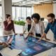 Marketing team collaborating on a digital strategy in a modern office