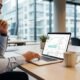 Digital marketer reviewing SEO performance on a laptop in a modern office